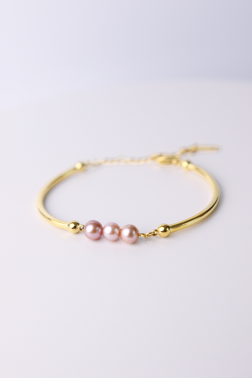 Trilogy of blush pearl bangle bracelet